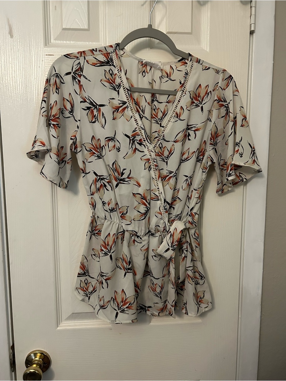 Sienna Sky Cream Floral Wrap Blouse with Orange and Black Accents